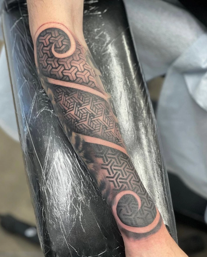 Blackwork mandala partial sleeve geometric pattern scroll tattoo done by tattoo artist Russ Howie of Sacred Mandala Studio in Durham, NC.